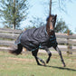 Black horse running in a fenced pasture wearing a Waterproof Horse Turnout Sheet - 1200D Ripstop with Coolmax Moisture-Wicking Lining