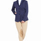 Woman wearing a navy TuffRider Ladies Starter Long Show Coat with beige riding pants against a white background
