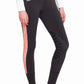 Woman wearing TuffRider Ladies Athena EquiCool Riding Tights with black and patterned side panels and knee grip detailing.