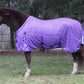 Horse wearing a purple TuffRider Power Mesh Plaid Fly Sheet standing outdoors near trees in a pasture