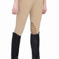 Woman wearing beige riding pants paired with black Tuffrider Air Mesh Washable Half Chaps and black riding boots
