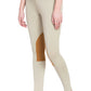 Model wearing beige TuffRider Ladies Prime Tights with brown knee patches, standing barefoot against white background
