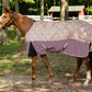 Horse wearing TuffRider Bonum 1200D Medium Weight Standard Neck Giraffe Print Turnout Pony Blanket outdoors near fence and trees