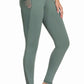 Woman wearing green TuffRider Ladies Minerva EquiCool Full Seat Tights with mesh pocket and full grip seat design