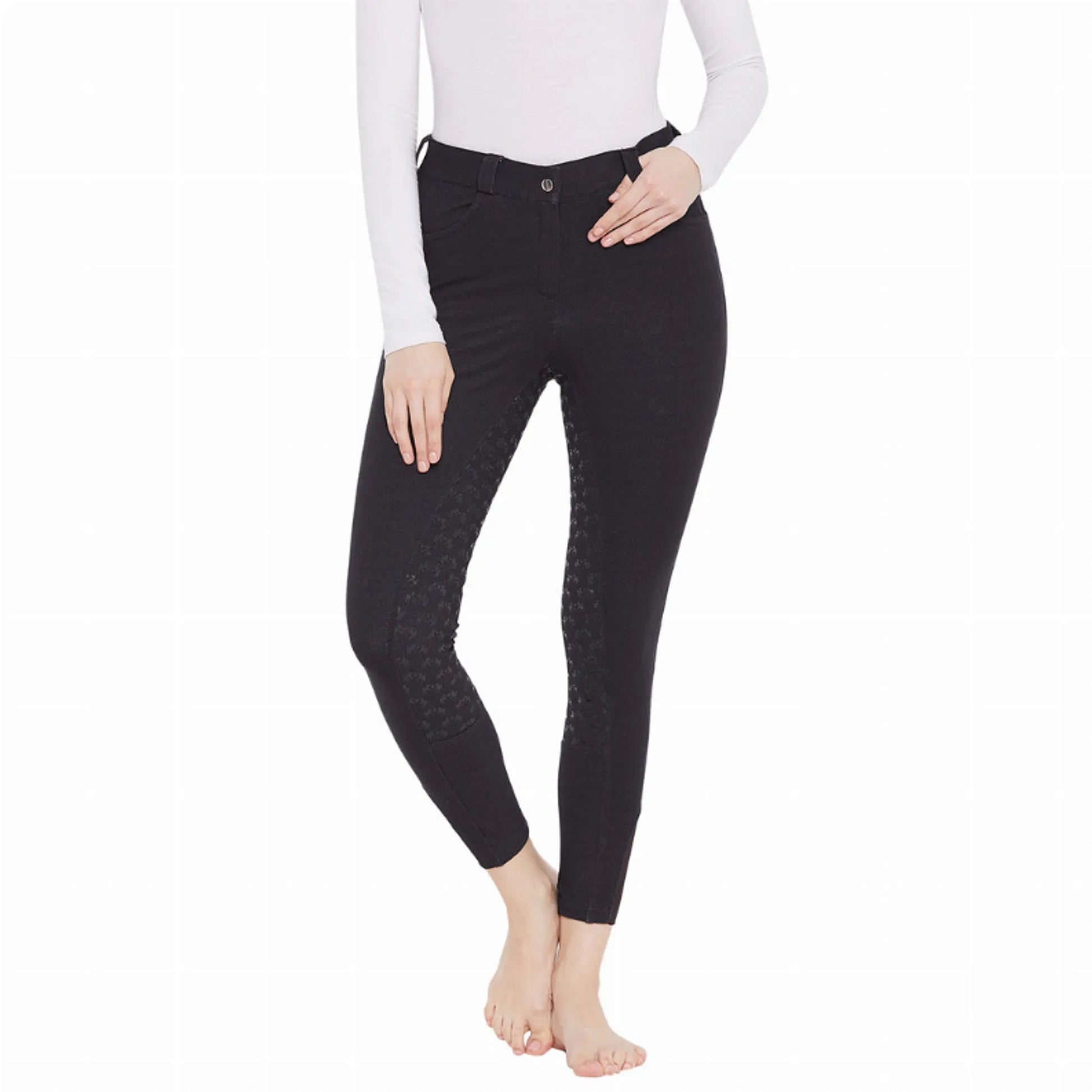 Woman modeling black EQUINE COUTURE HEATHER FULL SEAT BREECH with textured full seat design in equestrian gear.
