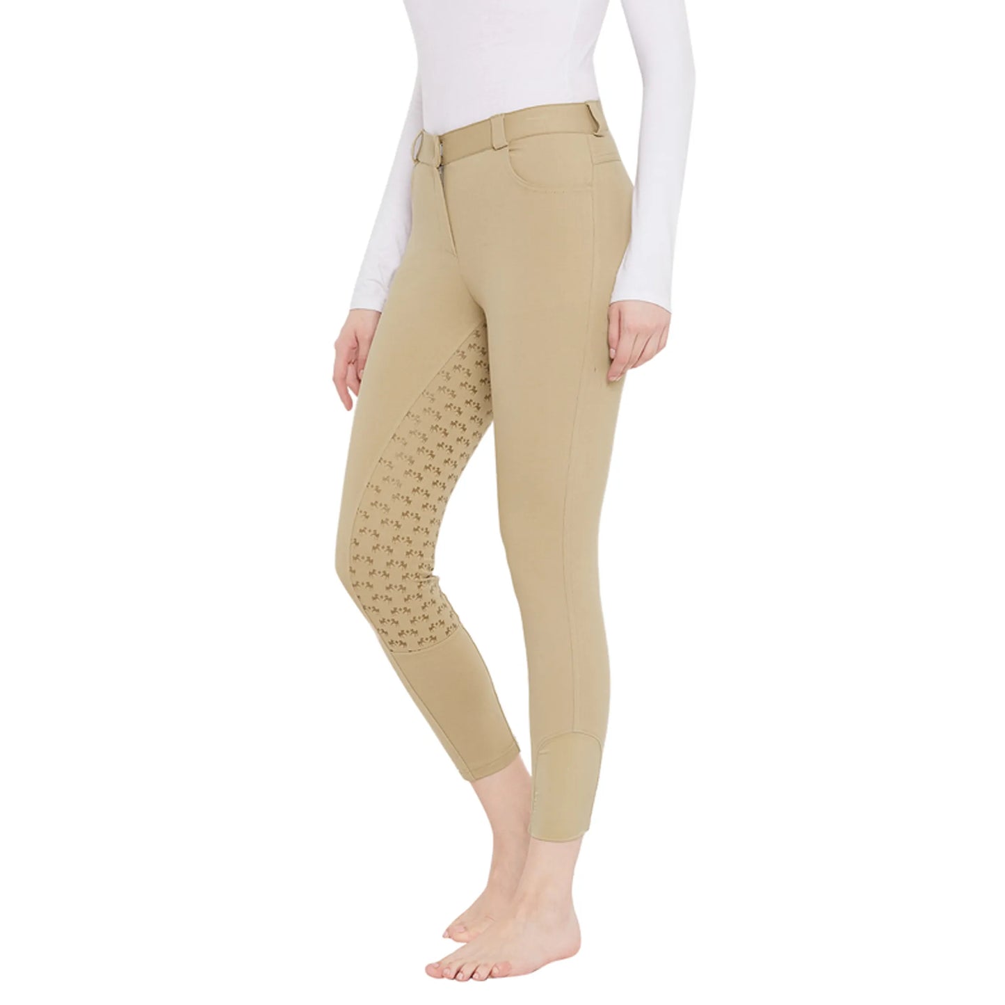 Woman wearing beige EQUINE COUTURE HEATHER FULL SEAT BREECH with grip pattern on inner legs for equestrian use