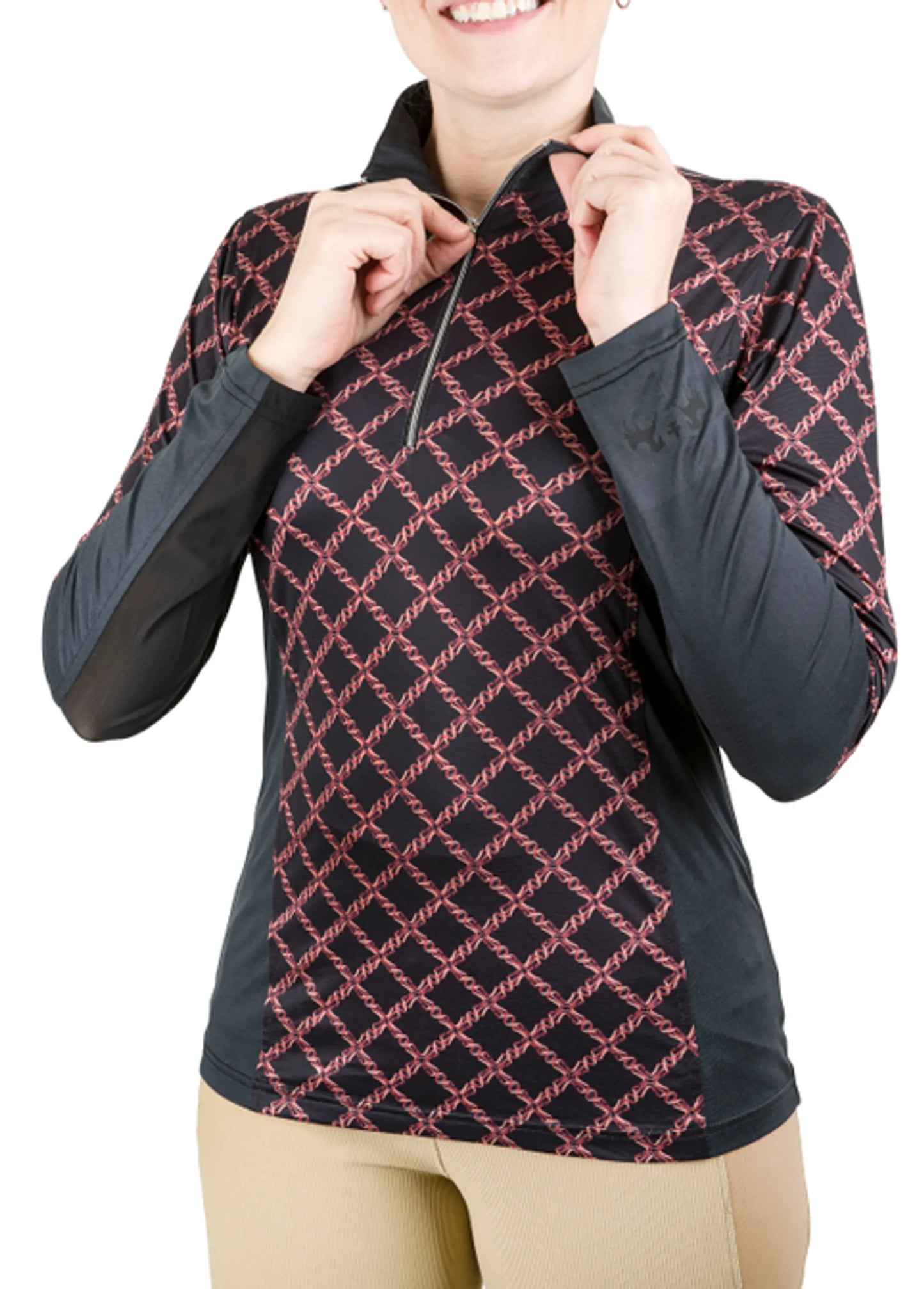 Woman wearing a black and red patterned EQUINE COUTURE EQUICOOL LEATHERWORKS SPORT SHIRT with beige pants, zipping collar.