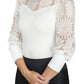 Woman wearing Spicy Girl Sage Long Sleeve Shirt by EC- White- L with floral lace puff sleeves and solid bodice
