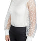 Woman wearing Spicy Girl Cardamom Long Sleeve Shirt by EC- White- L with sheer polka dot sleeves and black pants