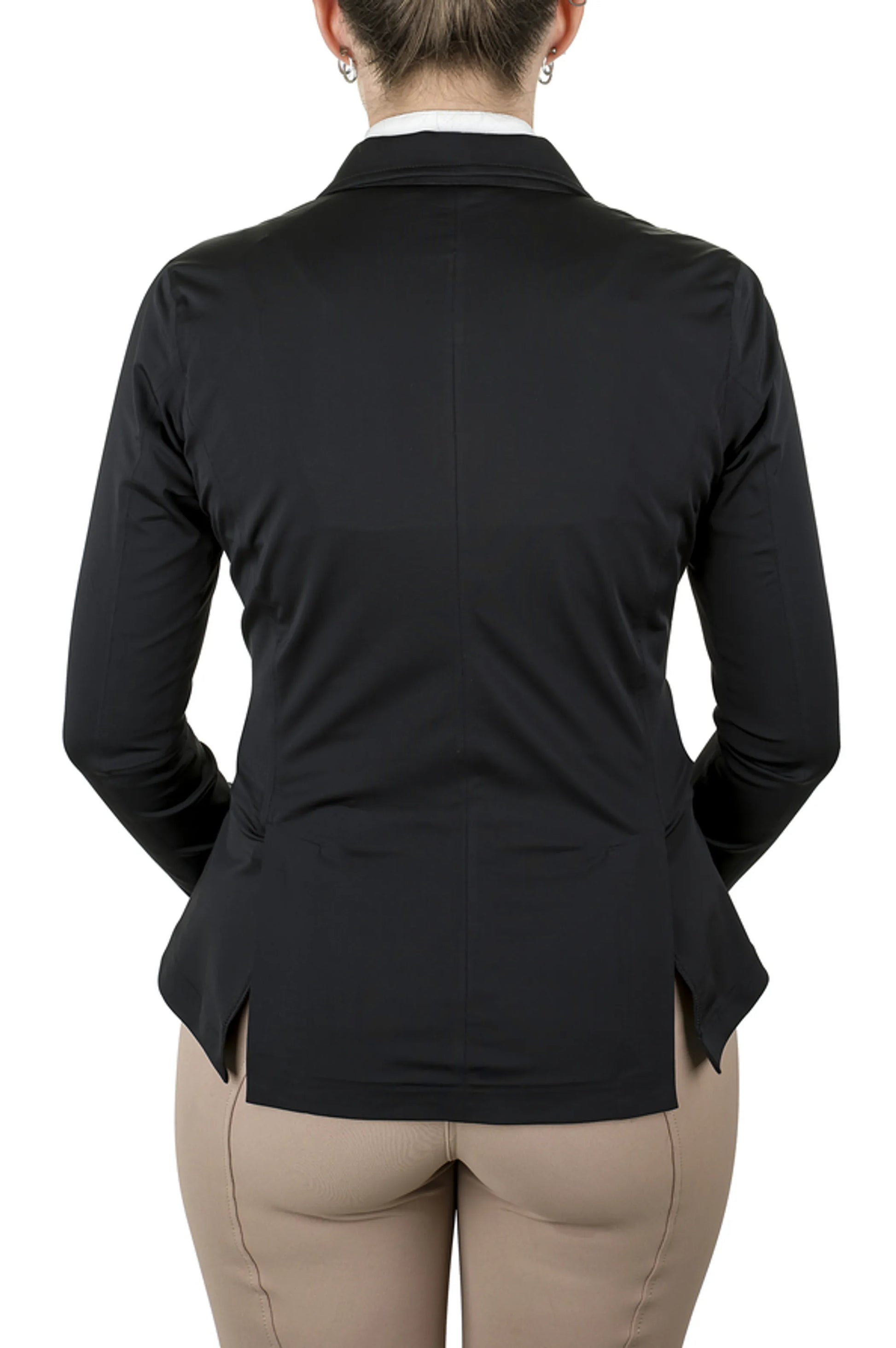 Woman wearing black Equine Couture Ladies Ultra Light Show Coat from the back with beige riding pants in white studio.
