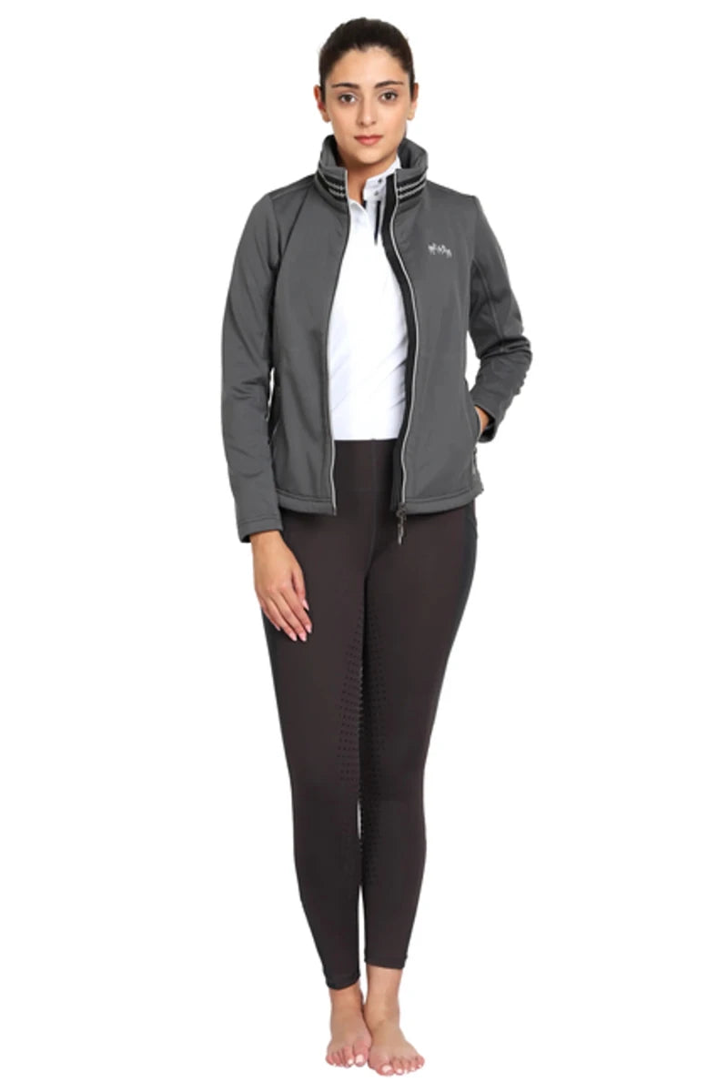 Model wearing EQUINE COUTURE LADIES BECCA SOFT SHELL JACKET WITH FLEECE in dark grey, styled for equestrian use.