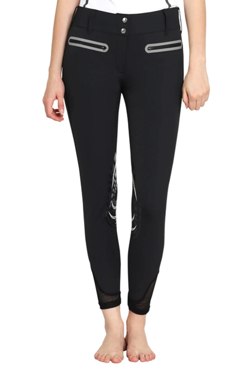 Front view of black EQUINE COUTURE LADIES IBIZA KNEE PATCH BREECHES with zipped pockets and knee patches, worn by model.