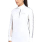 Woman wearing white EQUINE COUTURE LADIES ELIANA LONG SLEEVE SHOW SHIRT with black stripe details on sleeves