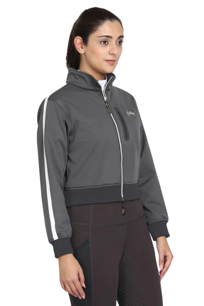 Woman wearing a dark gray EQUINE COUTURE LADIES PIPPA CROPPED JACKET with white stripe on sleeves and zippered front pocket
