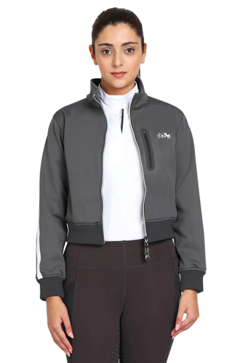 Woman wearing EQUINE COUTURE LADIES PIPPA CROPPED JACKET in gray with zip front and high collar, styled for equestrian use