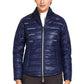Woman wearing navy blue EQUINE COUTURE LADIES ALPINE PUFFER JACKET with zip front and quilted design