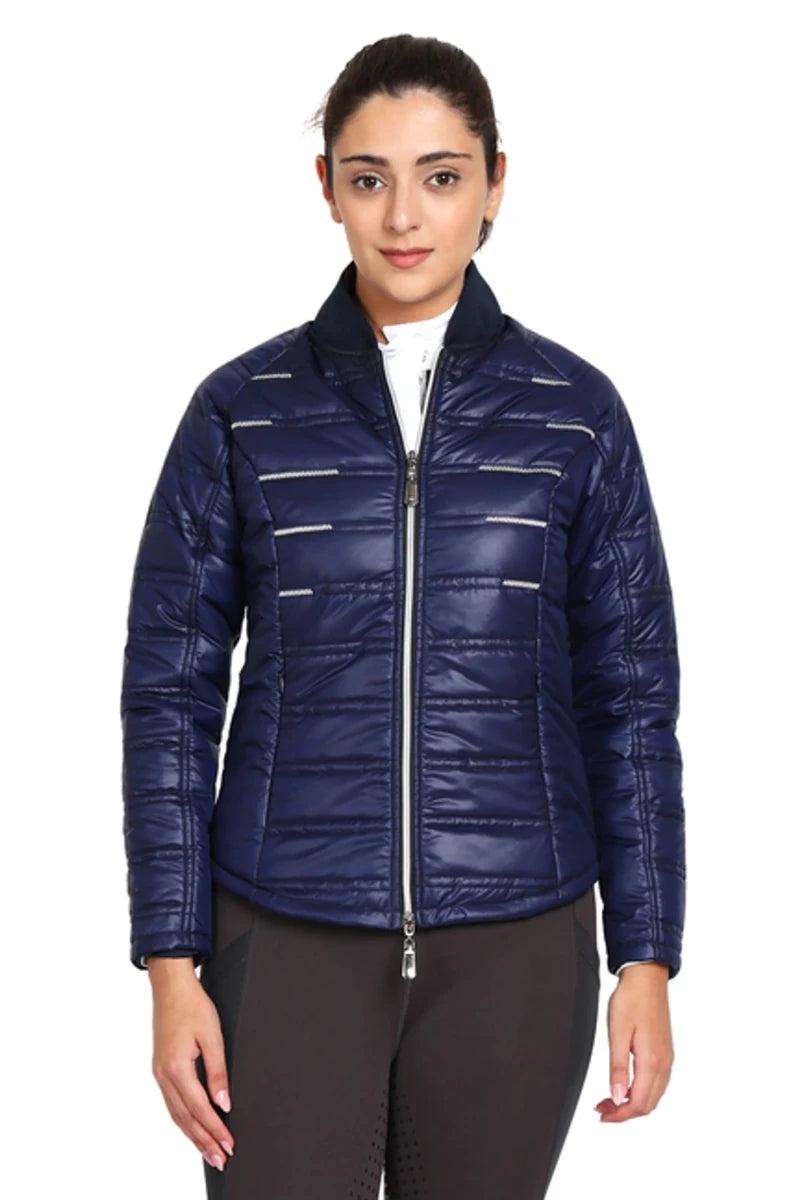Woman wearing navy blue EQUINE COUTURE LADIES ALPINE PUFFER JACKET with zip front and quilted design