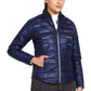 Woman wearing navy EQUINE COUTURE LADIES ALPINE PUFFER JACKET with zippered front and side pockets.