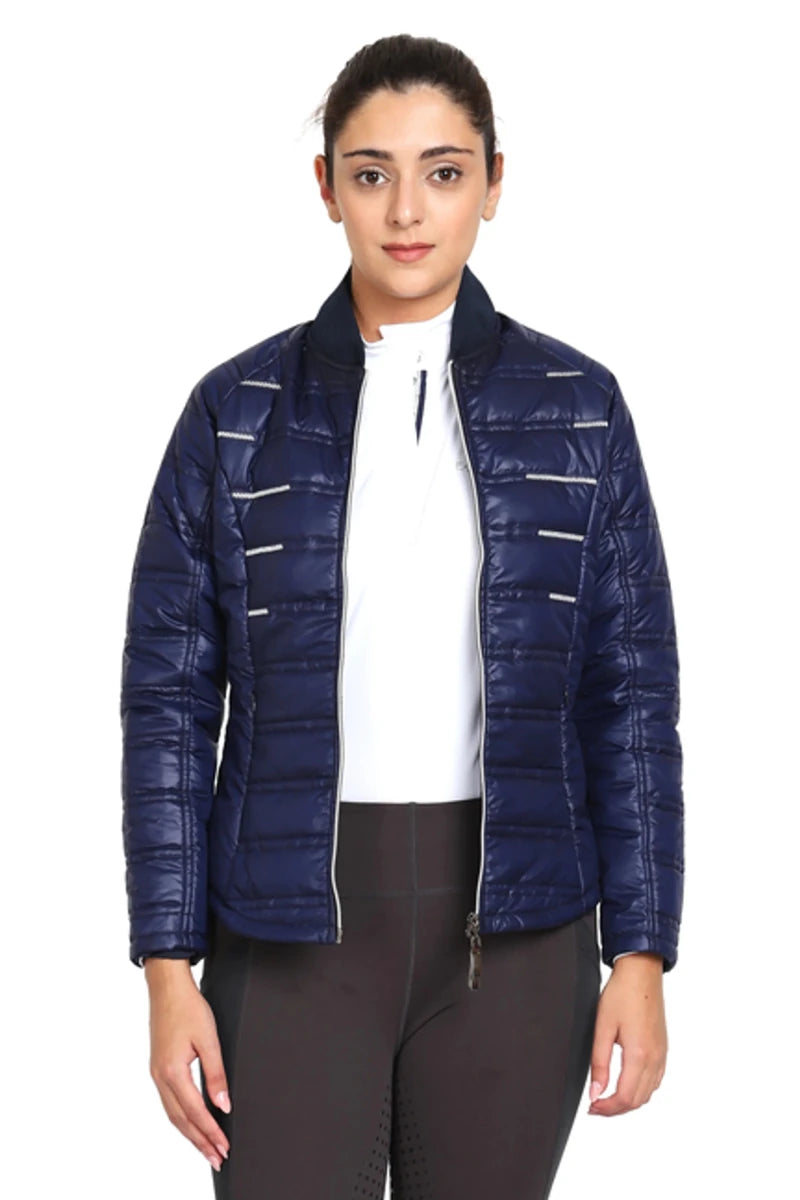 Woman wearing navy blue EQUINE COUTURE LADIES ALPINE PUFFER JACKET designed for equestrian outdoor wear