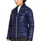 Woman wearing navy blue EQUINE COUTURE LADIES ALPINE PUFFER JACKET posing in white background