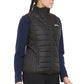 Model wearing black quilted Equine Couture Ladies Zima Vest over navy long sleeve top in side profile pose