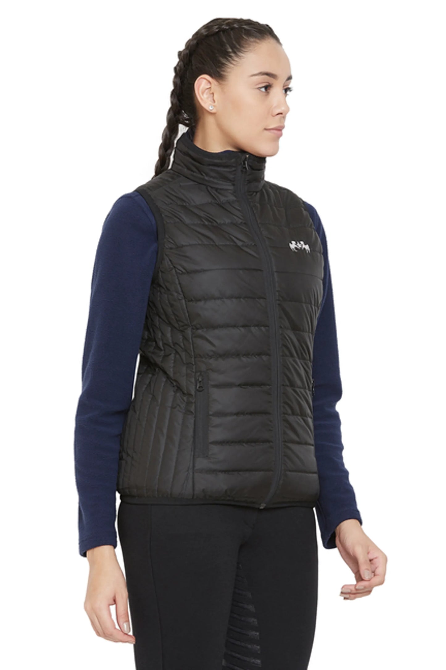 Model wearing black quilted Equine Couture Ladies Zima Vest over navy long sleeve top in side profile pose