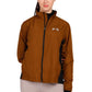 Woman wearing a brown and black Equine Couture Ladies Aberdeen Jacket with a horse logo on chest front