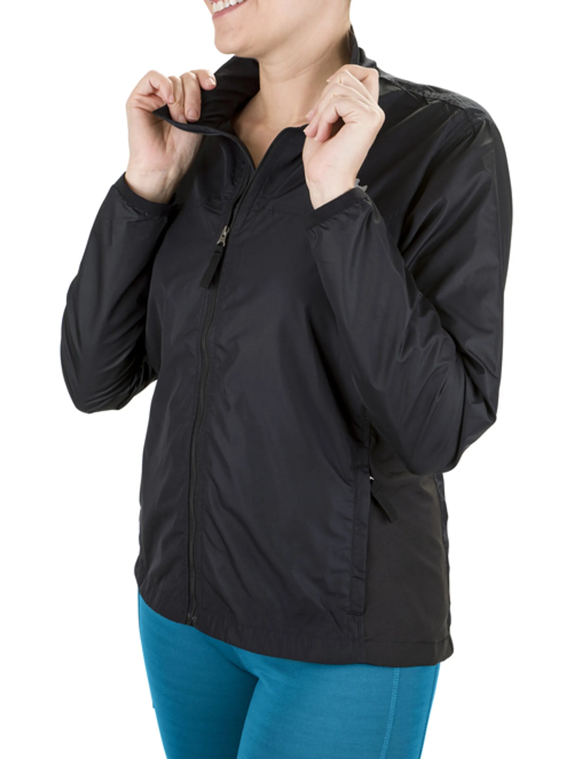 Woman adjusting collar of black Equine Couture Ladies Aberdeen Jacket wearing blue pants in bright studio setting