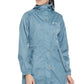 Woman wearing a blue Equine Couture Element Rain Jacket with hood and front buttons in an outdoor style pose