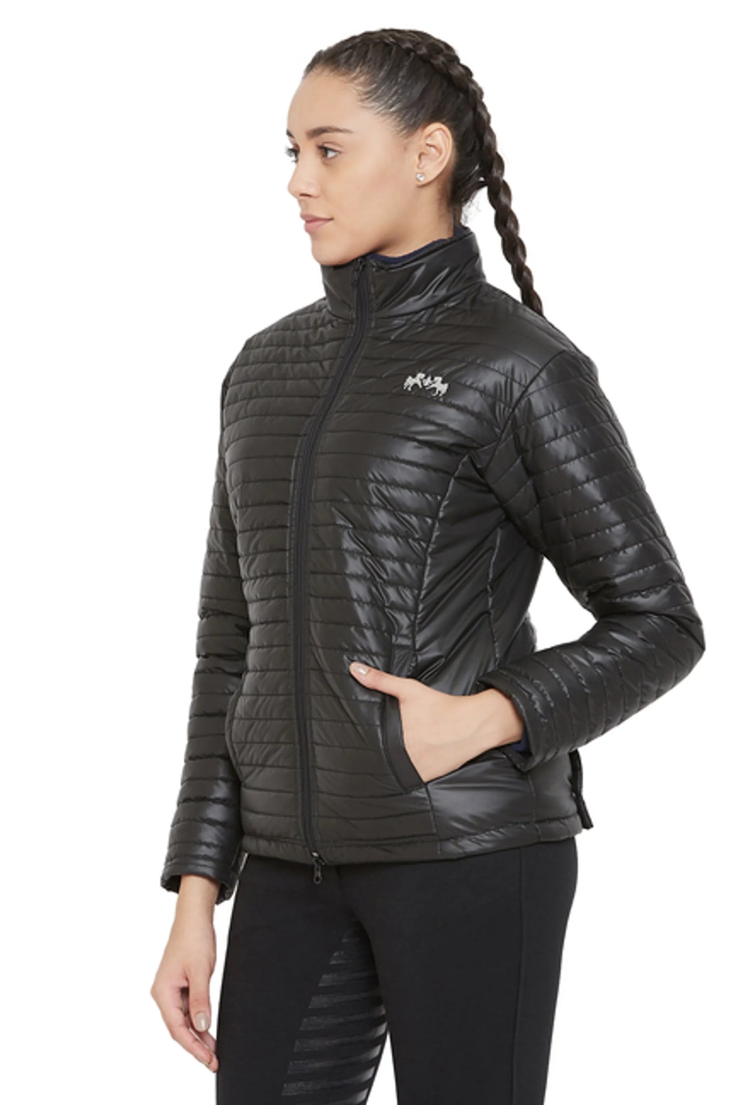 Woman wearing a black Equine Couture Ladies Zima Jacket with quilted design and zippered front pockets.