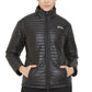 Woman wearing a black quilted Equine Couture Ladies Zima Jacket with hands in pockets and zipper closed