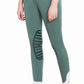 Female model wearing George H Morris Ladies Add Back Silicone Knee Patch Breeches - Premium Coolmax Microfiber Euroseat Riding Pants in green with white cuffs