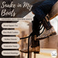 Child wearing TuffRider Kid's Black Snake in My Boot Western Leather Boots with snakeskin pattern and stitched detailing