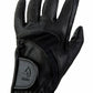 Black perforated leather riding glove with adjustable strap, shown on a hand, Lettia Como Glove