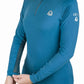 Woman wearing a blue Lettia Women Quarter-Zip Neck UPF 50+ Sun Shirt with long sleeves and zipper detail.