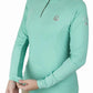 Woman wearing a light blue Lettia Women Quarter-Zip Neck UPF 50+ Sun Shirt adjusting the sleeve cuff