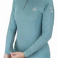 Woman wearing a blue Lettia Women Quarter-Zip Neck UPF 50+ Sun Shirt adjusting the sleeve cuff