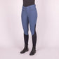 Model wearing Euro-Star Riding Breeches ESAirflow FullGrip-Dark Berry-38 in blue with black full grip knee patches and boots