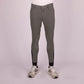 Front view of a person wearing Euro-Star Riding Breeches ESCamillo KneeGrip-Castor Grey-52 with black knee grip patches and sneakers
