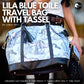AWST INTL LILA BLUE TOILE PATTERN TRAVEL BAG withTASSEL featuring adjustable handles and vegan leather trim