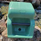 Drinking Spot Outdoor Gravity-Fed Dog Waterer 2.5 Gallon green setup on rocks near a water stream in nature setting