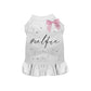 White pet dress with ruffled hem, pink bow, decorative rhinestones, and "#SELFIE Dress" text on back