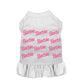 White pet dress with pink repeating Barbie Girl logo pattern and a ruffled skirt for small pets.