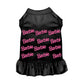 Black pet dress with pink repeated Barbie Girl logo and ruffled skirt for stylish small pets.