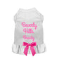 White dog dress with pink "Beverly Hills Beauty" text and decorative pink bow, Beverly Hills Beauty Dog Dress