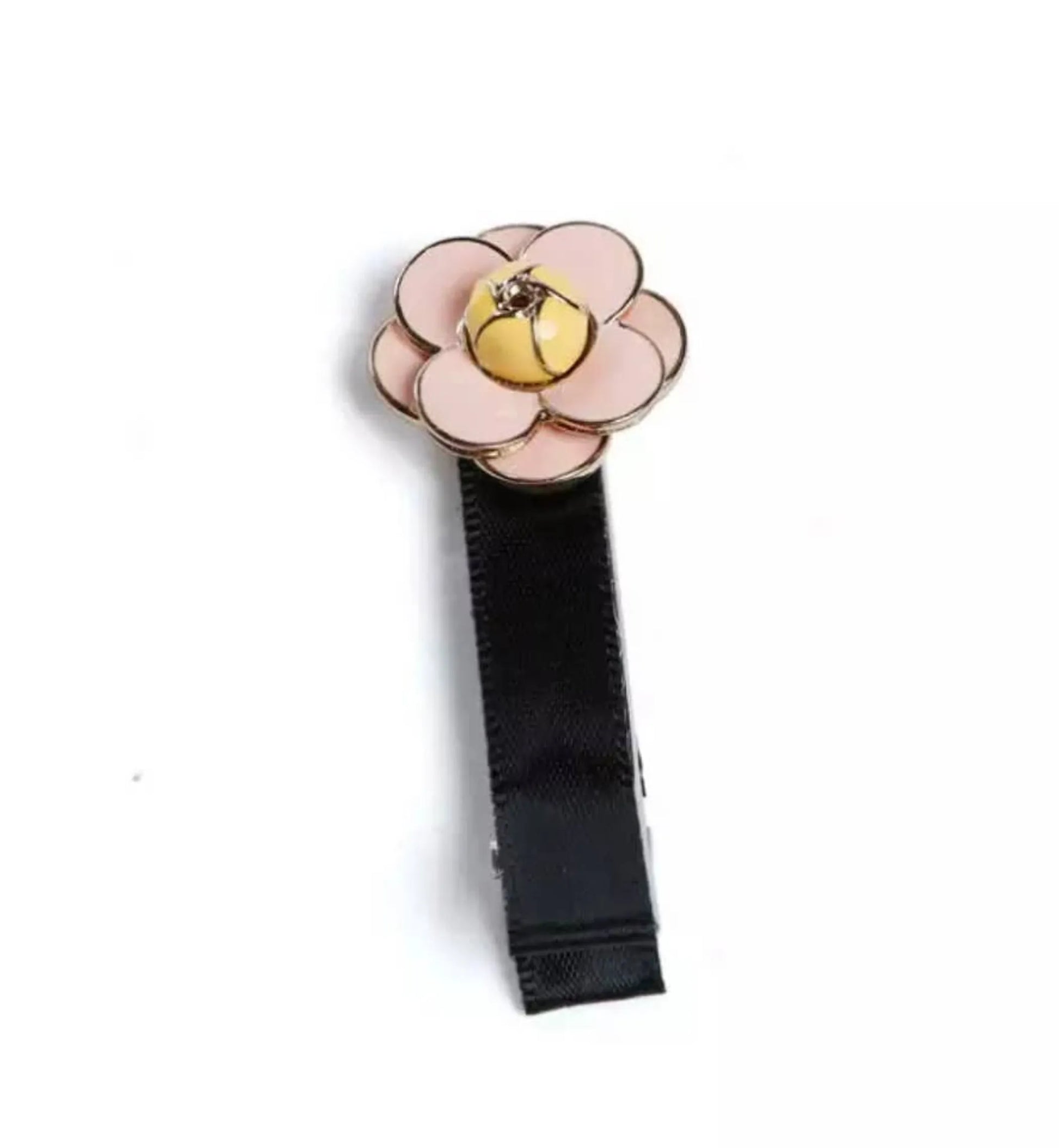 Camellia Hair Clips featuring a pink flower design with a yellow center on a black fabric clip.
