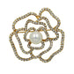 Camellia Luxury Brooch with gold-tone crystal petals and a central white pearl accent in a floral design