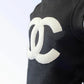 Close-up of black fabric tee with textured white interlocking CC logo, CC Puff - Color: Black | Pack Of: 1 | Style: Tee.