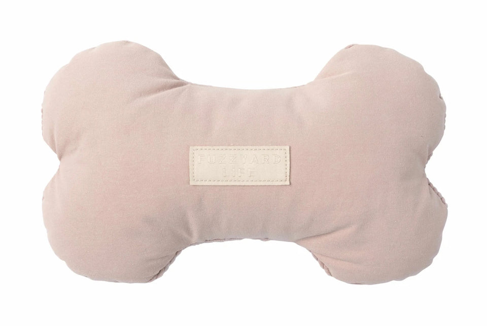 Blush pink FuzzYard Life bone-shaped plush dog toy, front view