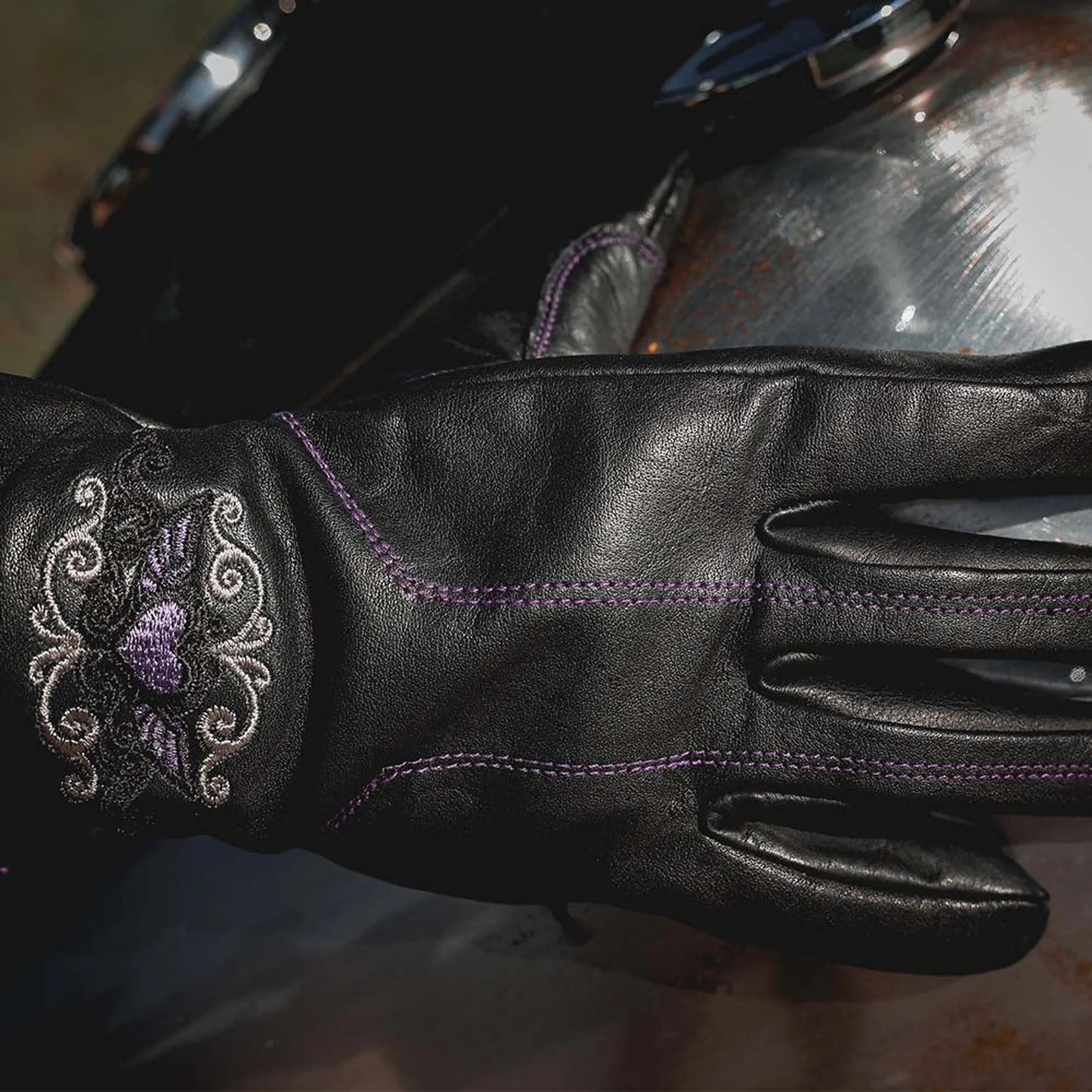 8144.17 - Ladies Full Finger Gloves in black leather with purple stitching and decorative embroidery design